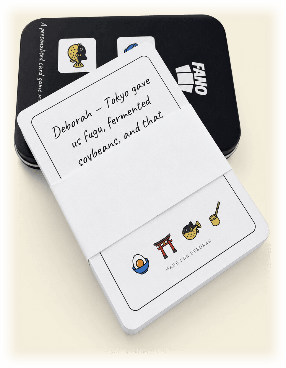 A FANO deck with its dedication card, leaning on the custom tin